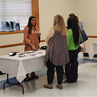 Students observe a blood pressure measurement demonstration during a B2B 2.0 workshop.
